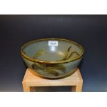 An Alan Ward art pottery bowl, sage green ground,