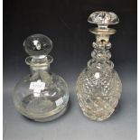 A cut glass mallet shaped decanter with silver collar, London hallmarks; another,