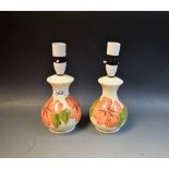 Moorcroft - a pair of Hibiscus pattern lamp bases,