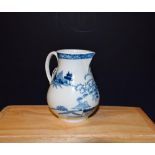 A Liverpool baluster cream jug, decorated in underglaze blue with hut fence and foliage,