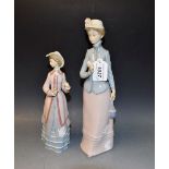 A Lladro figure of an elegantly dressed lady holding a single rose,