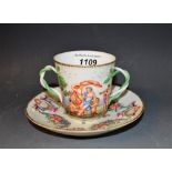 A 19th century Naples two handled chocolate cup and saucer