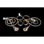 Six pairs of silver earrings