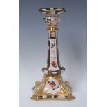 A Royal Crown Derby 2451 pattern Castleton candlestick, dolphins to angles, 27cm high,