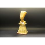 An alabaster table lamp in the form of Nefertiti