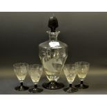 An Art Deco decanter and four glasses, frosted with sailing boats, sun, palm trees and mountains,