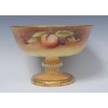 A Cavershall pedestal bowl, painted by Neil Higgins, signed, with ripe apples, pears,