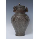A 19th century Eastern jar and cover, cast with figures, the neck with suspension chain,