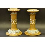 A pair of Doulton candlesticks