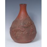 A Yixing ovoid bottle vase, decorated in relief with dragon among clouds,