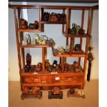 A collection of Japanese hardwood Netsuke, various forms including mythical animals, deity's,