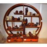 A collection of Japanese hardwood Netsuke, various forms including mythical animals, deity's,