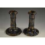 A pair of Denby Majolica Ware candlesticks, in mottled blue and brown, 15cm high, c.