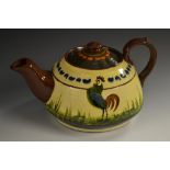 A Torquay Pottery Mottoware large teapot and cover, decorated with green,