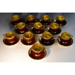 A set of twelve Carlton Ware Rouge Royale coffee cups and saucers,