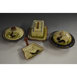 A Torquay Pottery Mottoware butter dish, decorated with black cockerel,