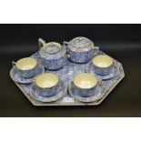 A Staffordshire blue and white tete a tete comprising of a tray , teapot, sucrier,