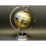 A mid 20th Century chromed globe thermometer and barometer combination made in Western Germany