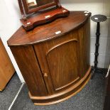 A mahogany corner cupboard;