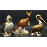 A Royal Crown Derby paperweight, Puffin, silver stopper; Kangaroo, silver stopper; Brown Pelican,