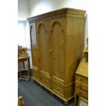 A contemporary pine wardrobe