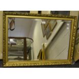 A gilt framed rectangular mirror