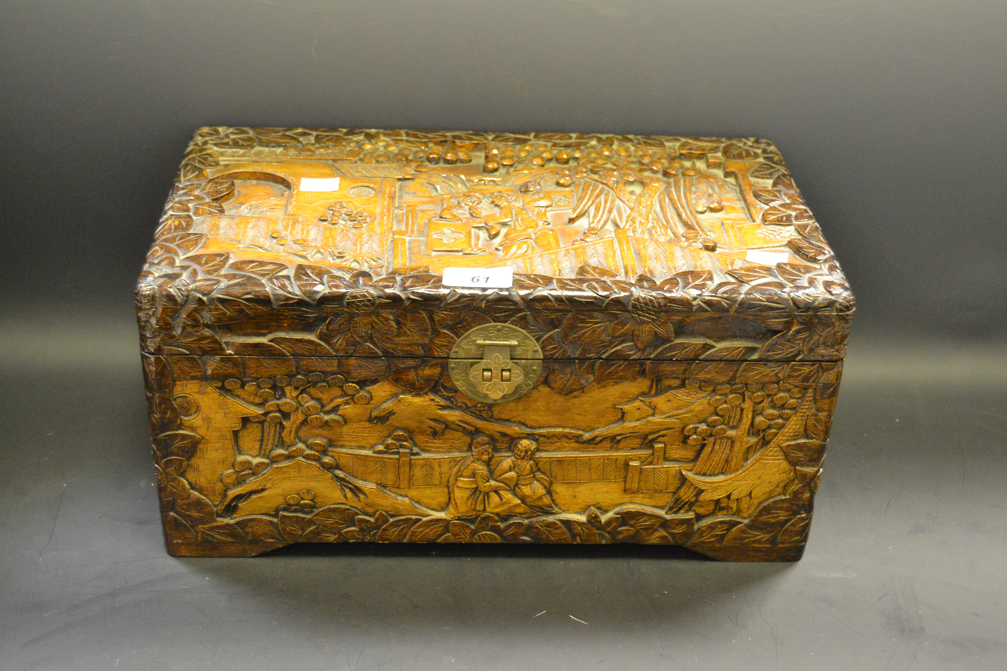 A carved camphor wood chest 20cm high x 23cm deep x 40cm wide