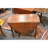 An oak drop leaf table , barley twist supports, c.