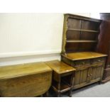 An early/mid 20th century oak dresser; a mid 2oth century tea trolley;