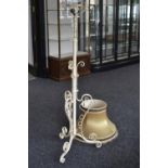 A wrought iron telescopic standard oil lamp converted for electricity.