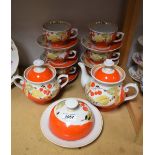 Ceramics - a Ukranian tea service, vivid orange berry design on white ground,