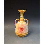 A Royal Doulton twin handled bud vase, floral and gilt,