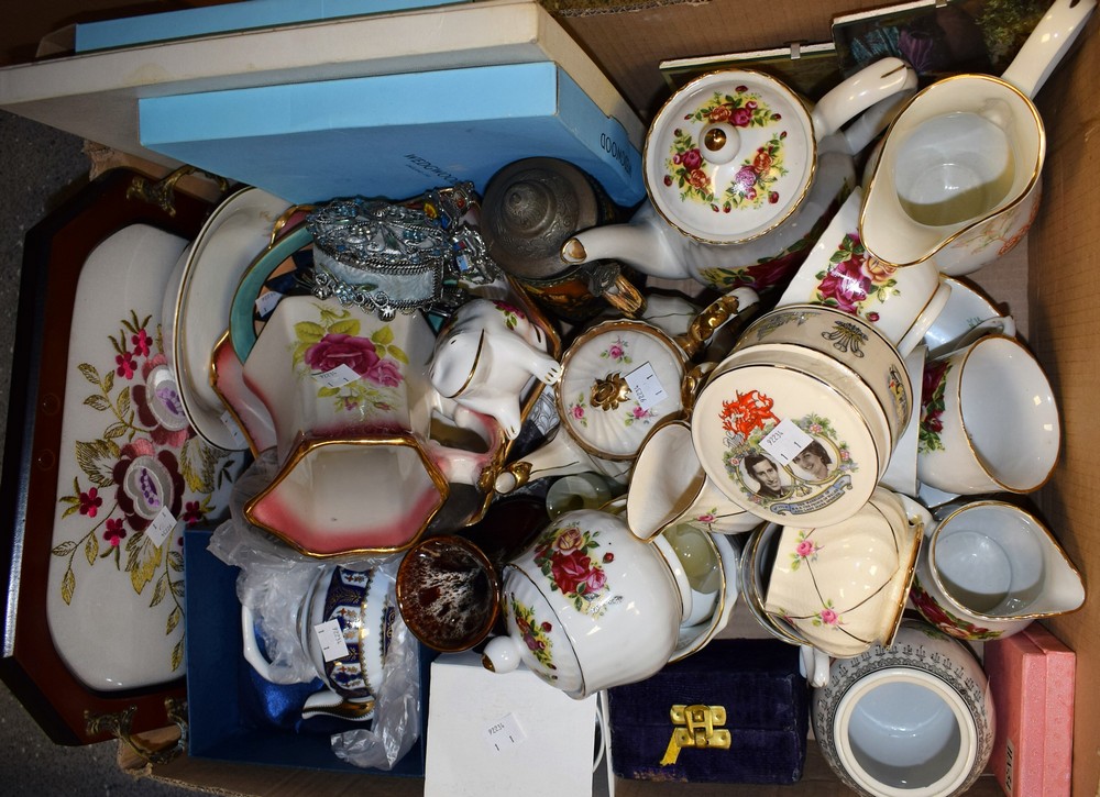 Ceramics - a part tea service, roses on a white ground to include teapot, five cups, six saucers,