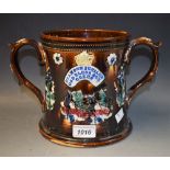 A large bargeware twin handled loving cup commemorating Queen Victoria's Diamong Jubilee, 1897,