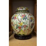 A 19th century Chinese ginger jar on hardwood stand