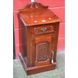 A Victorian style mahogany bedside cupboard, broken swan neck pediment,