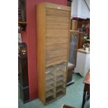 A tall pine tambour front filing cabinet. 195cm high x 61cm wide x 29cm deep.