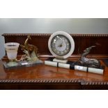 A French Art Deco slate and onyx mantel clock, gilt brass mounted circular dial, Arabic numerals,