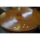 A Victorian mahogany tilt-top centre table, circular top, turned column and underfinial,