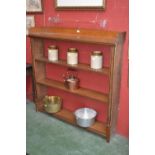 An Edwardian oak open bookcase, three quarter galleried top, c.