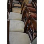 Three regency mahogany dining chairs, curved top rail, X-frame back, stuffed overseat,