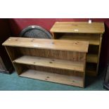 A contemporary low pine bookcase;