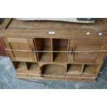 A Victorian stripped pine wall unit, stepped cornice, an arrangement of cupboards, drawers,