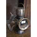 A brass Lucas No 63 King of the Road lamp.