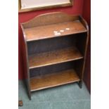 A small oak floor standing bookcase.