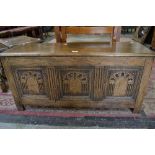 An elm blanket chest, stile feet, carved panel front,