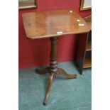 A reproduction oak tilt top occasional table, rounded rectangular to, baluster column,