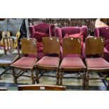 A set of four oak panel back chairs,