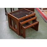 A teak nest of tables,