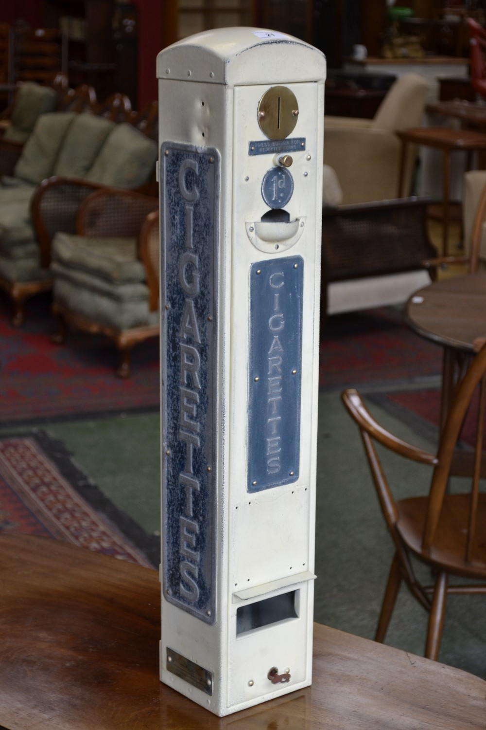 A vintage wall mounted cigarette dispensing machine by National Automatic Machines Ltd.